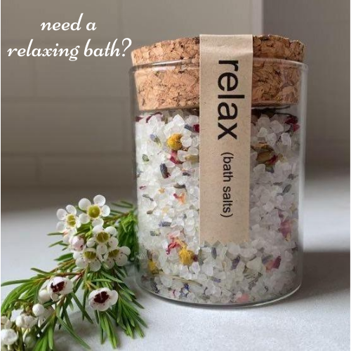 200g cork and glass jar called "relax" bath salts with white bath salts, essential oils, and coloured flowers inside.