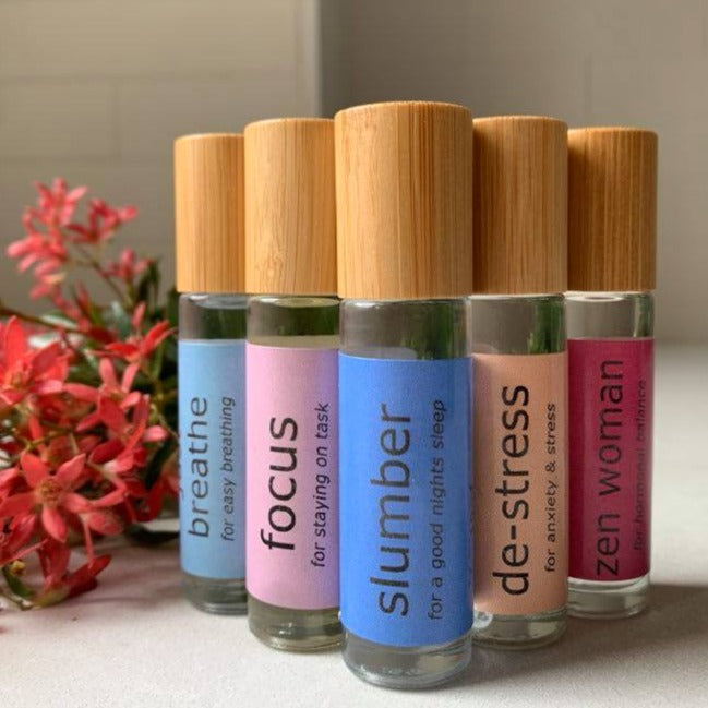 slumber essential oil roller with Lavender, Frankincense and Vetiver. focus roller blend with Basil, Douglas Fir, Wild Orange, just breathe roller blend with Eucalyptus, Peppermint, Rosemary, de-stress roller blend with rankincense, Lavender, Litsea, zen woman roller blend with Clary Sage, Fennel, Cedar Wood, Litsea all blended with fractionated coconut oil