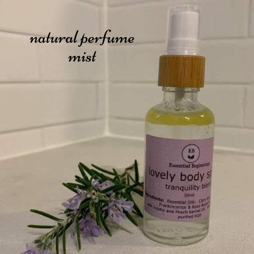 50ml natural bamboo and glass spray bottle with lid and pink label containing essential oils for women.
