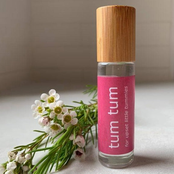 10ml bamboo and glass essential oil roller bottle for babies' tummy issues.
