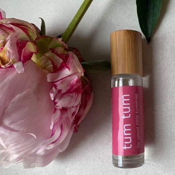 10ml bamboo and glass essential oil roller bottle for babies' tummy issues.